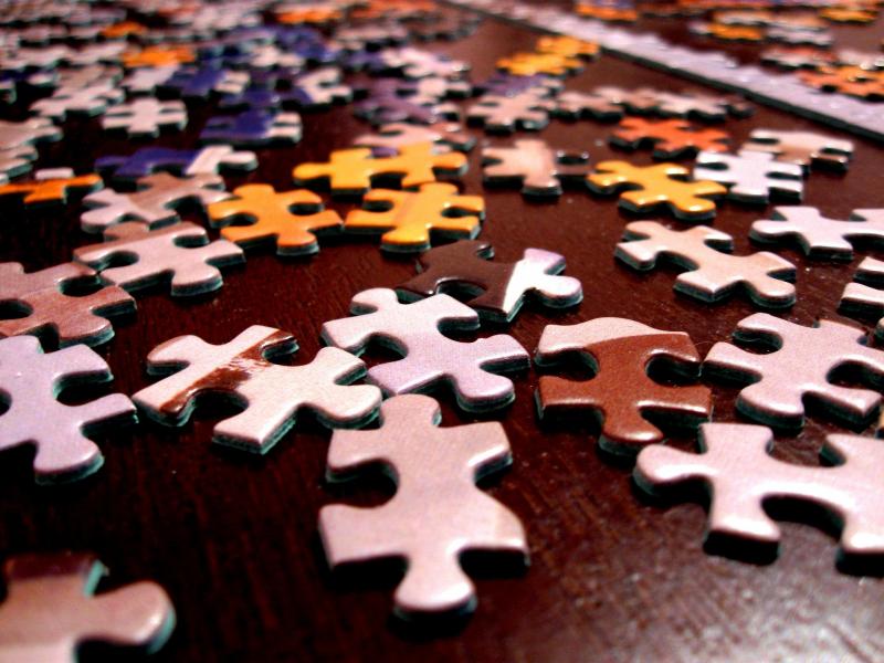 Close up of scattered jigsaw puzzle pieces