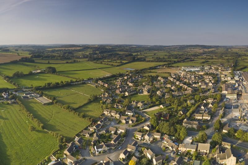 Birds eye view of town edge and fields