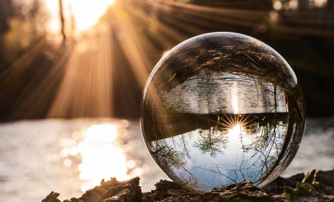 Crystal Ball reflecting sunlit landscape in background
